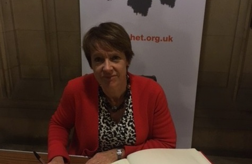 Dame Caroline signs the Holocaust Educational Trust Book of Remembrance