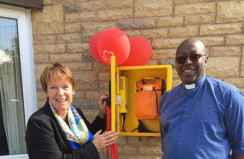 Caroline with Rev. Tony and the new defibrillator unit