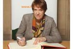 Caroline Spelman MP signs the Holocaust Education Trust Book of Commitment 